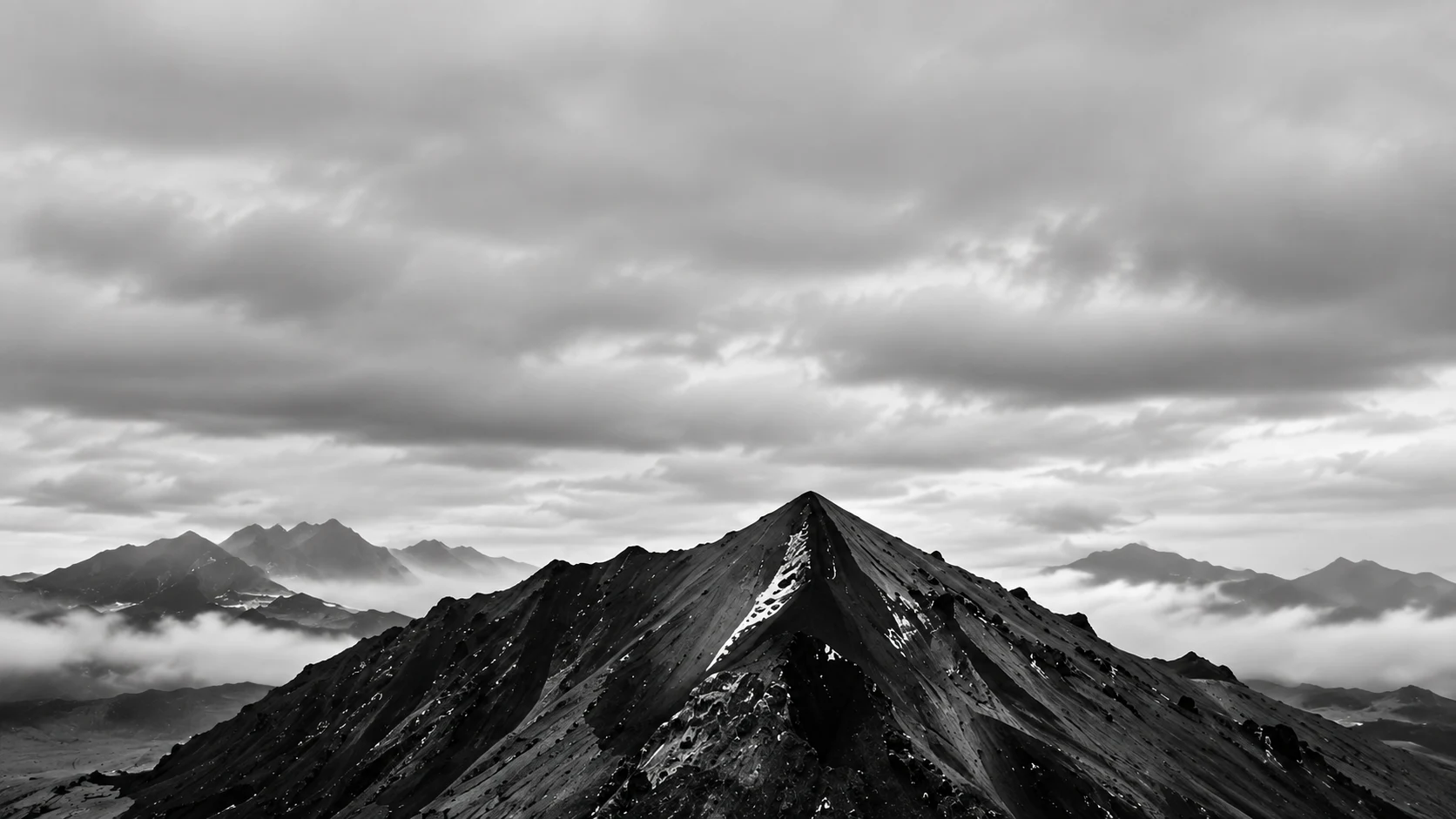 A sharp volcanic peak above a sea of clouds